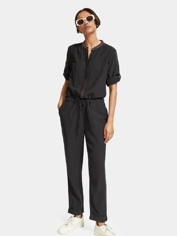 Jumpsuit with arrow head trim